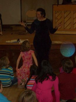 Allison tells a story at a Family Dance at Heberton Hall, Keene, NH. Photo by Michael Catanzaro. Allison tells a story at a Family Dance at Heberton Hall, Keene, NH. Photo by Michael Catanzaro.